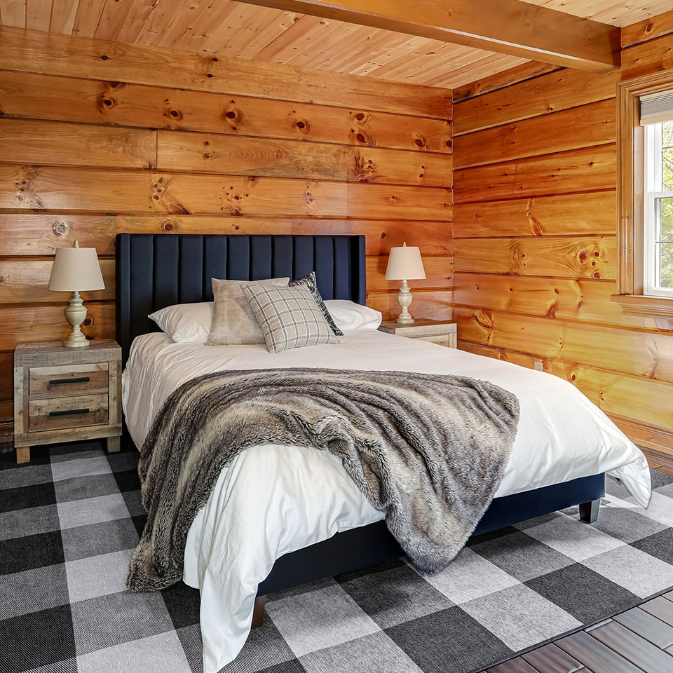 cabin decor in bedroom with buffalo plaid rug