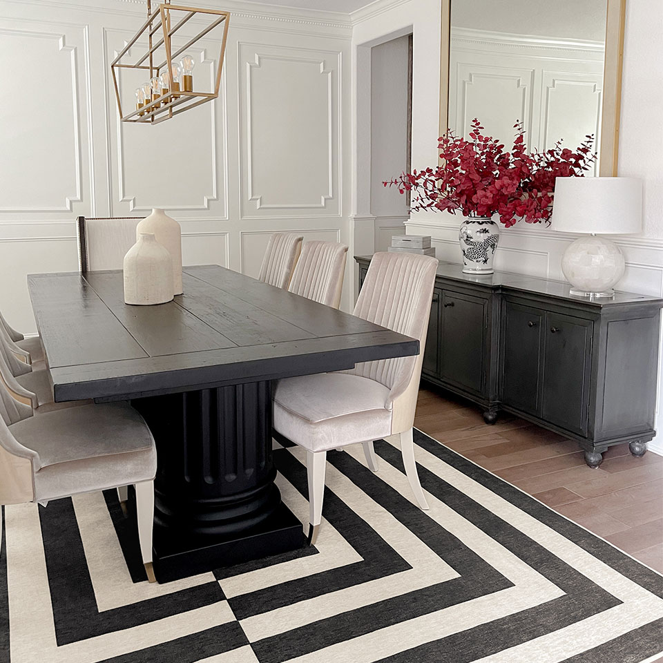 black and white dining room with modern rug