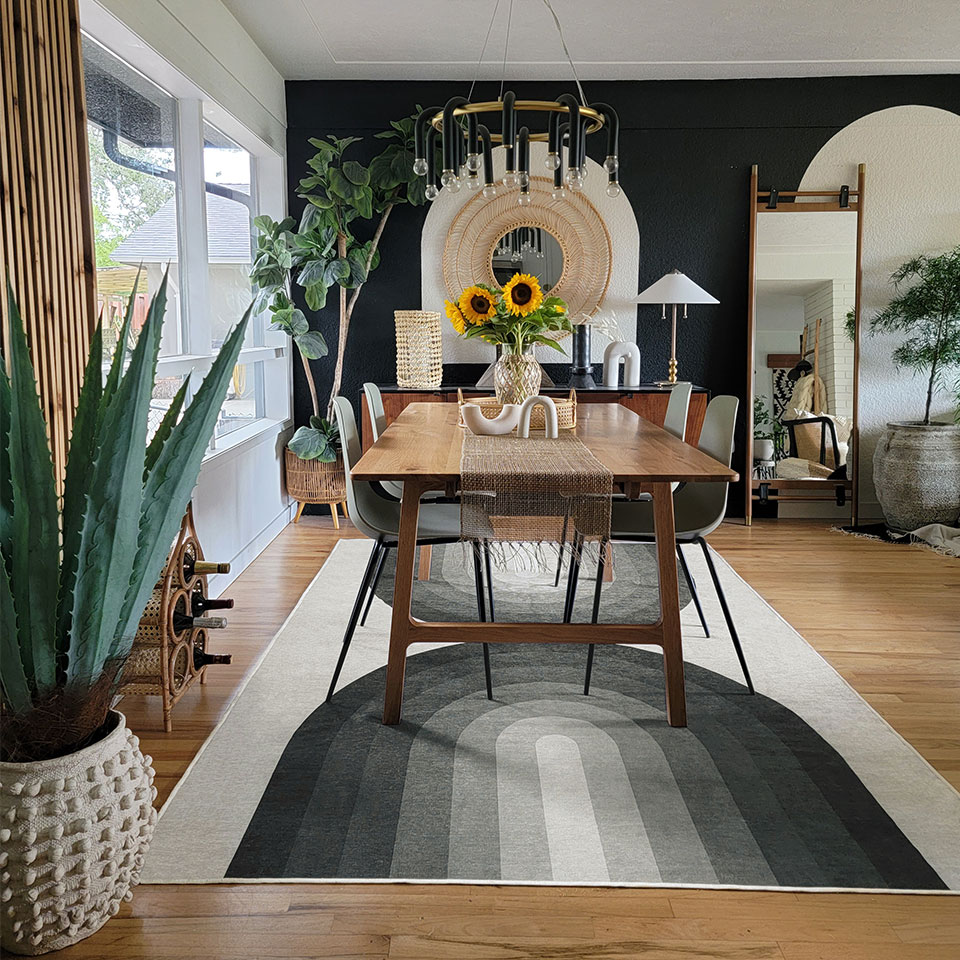 black and white dining room with retro rug
