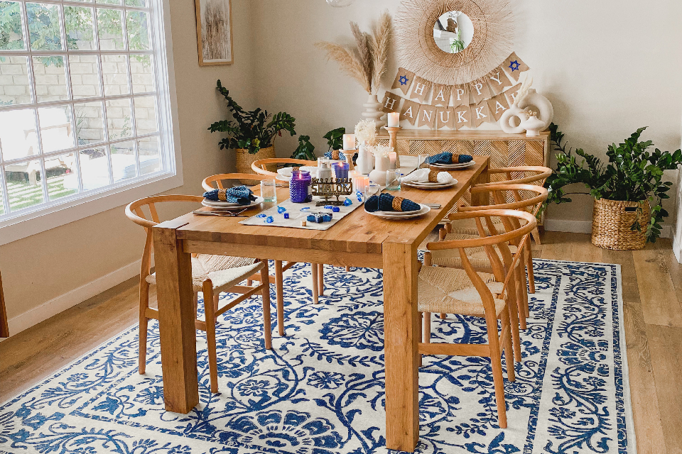 hannukah decorations in dining room with blue floral rug