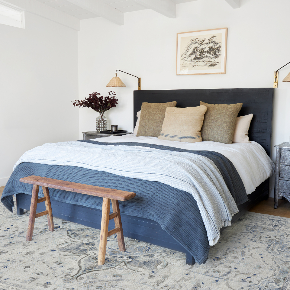 hanukkah decorations in bedroom with vintage inspired blue rug