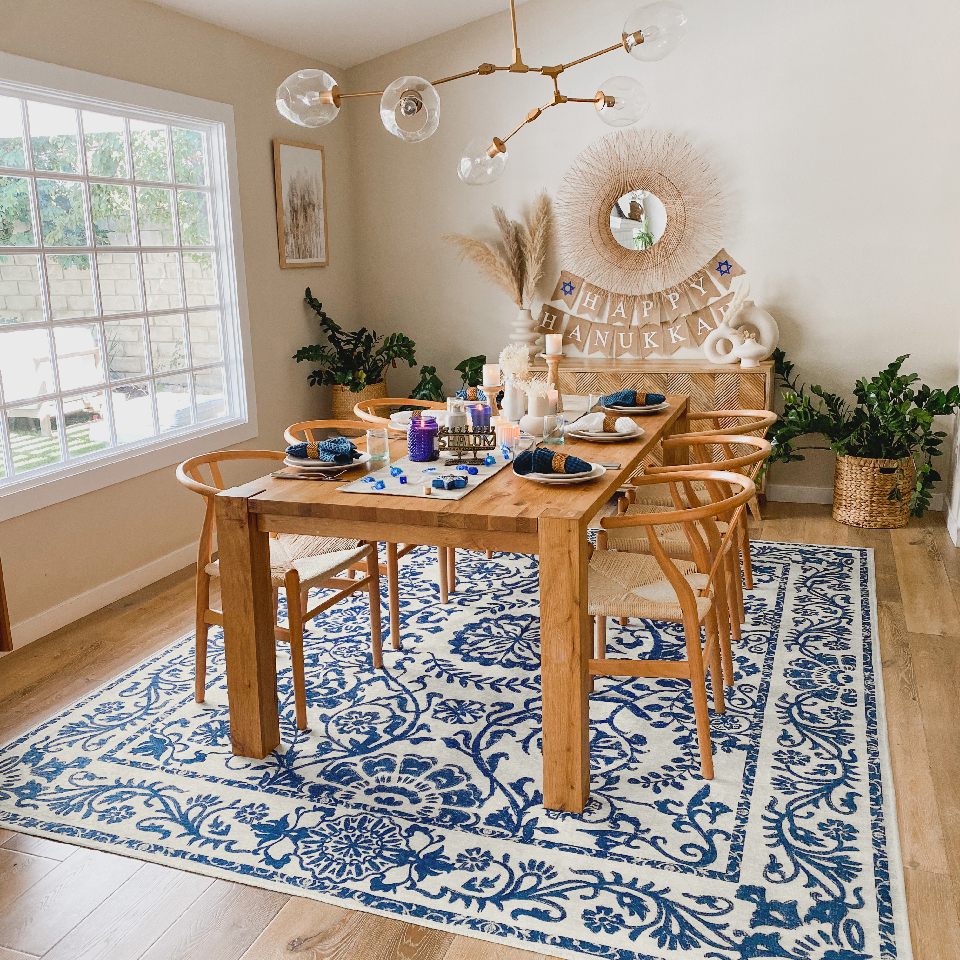hanukkah decorations in dining room with blue floral rug