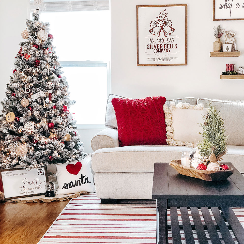red striped rug in living room with christmas decor