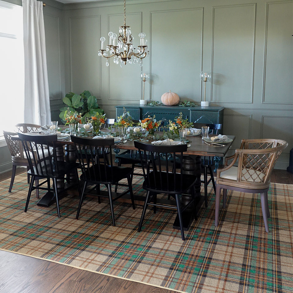 thanksgiving decor in dining room with plaid rug