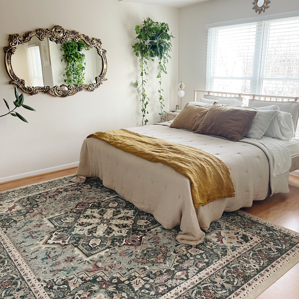 green Persian style rug in bedroom