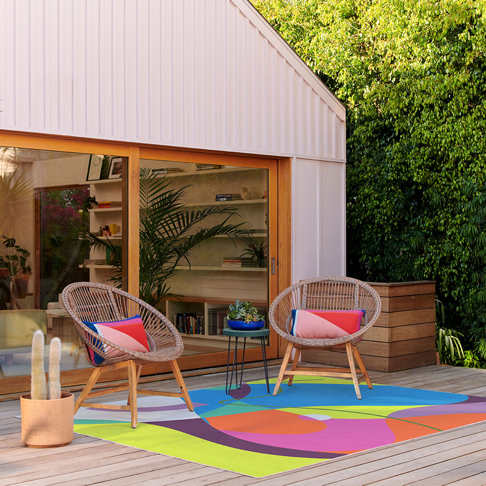 colorful outdoor rug on porch