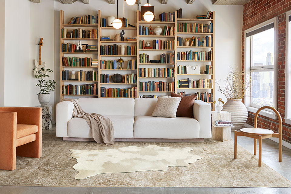 layered faux hide rug in living room